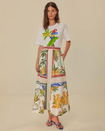 model wearing white midi skirt with floral panels and lace detail