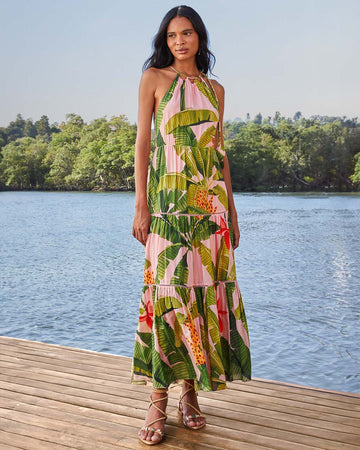 model wearing pink banana leaves maxi dress with ric rac tiers, cut-out top and open back