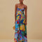 model wearing blue abstract print maxi dress with corset bodice