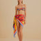 model wearing tied colorful bold floral swim cover up