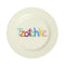 cream dish with colorful 'Tzotchke' across the front