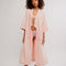 model wearing pink long robe with bright pink trim