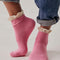 model wearing bubblegum pink waffle socks with cream crochet ruffle trim