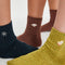 speckled crew socks: navy socks with snowflake, rust with sweater and yellow with mitten