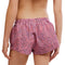 back view of model wearing pink and red crinkle boxer lounge shorts