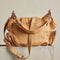 back view of tan saddle bag crossbody with silver hardware