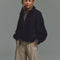 model wearing black vegan suede relaxed fit jacket