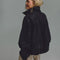 back view of model wearing black vegan suede relaxed fit jacket