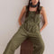 model wearing relaxed fit olive green cotton overalls