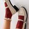 model wearing rust red crew socks with cream lace tops with cream mary jane flats