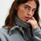 model wearing grey knit triangle essential scarf