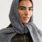 up close of model wearing grey extra large balabonnet tied under the chin