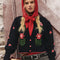 model wearing black cropped cardigan with red folk floral print on the front and sleeves