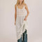 model wearing white sheer maxi slip dress with lace and ruffle details