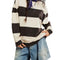 model wearing black and white thick striped pullover crewneck sweatshirt