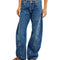 model wearing low rise dark denim barrel jeans