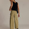 back view of model wearing aloe wide leg high rise barrel leg chino pants