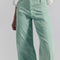 up close of model wearing mint wide leg jeans