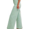 side view of model wearing mint wide leg jeans