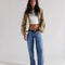 model wearing low rise medium denim wash boyfriend jeans
