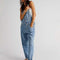 model wearing powder blue denim relaxed fit overalls
