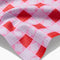 up close of pink and red quilt bar towel