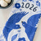 folded white tea towel with blue sparrow birds and 2026 'calendar' by month