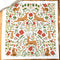 white tea towel with all over poinsettia, deer, rabbit, and fox print