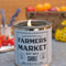 light blue farmer's market candle on a table