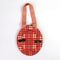 back view of red, peach, and brown plaid round fabric frame ornament