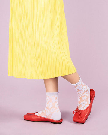 model wearing sheer crew socks with periwinkle floral print