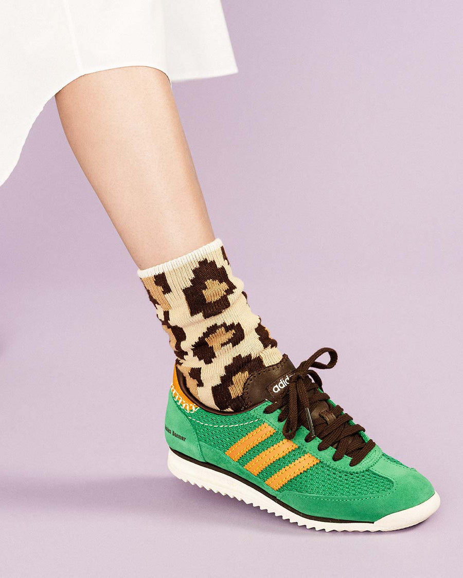 up close of model wearing tan pixelated leopard print crew socks