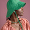 side view of model wearing kelly green tulip bucket hat