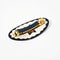 underside of round pony barrette with tortoise quilt inspired six point star and black trim