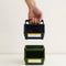 model holding navy and green caddy