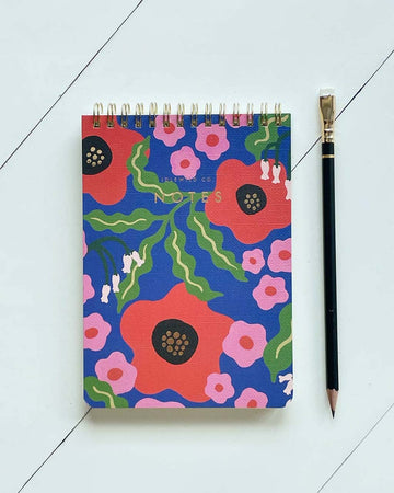 blue jotter notebook with red abstract floral print