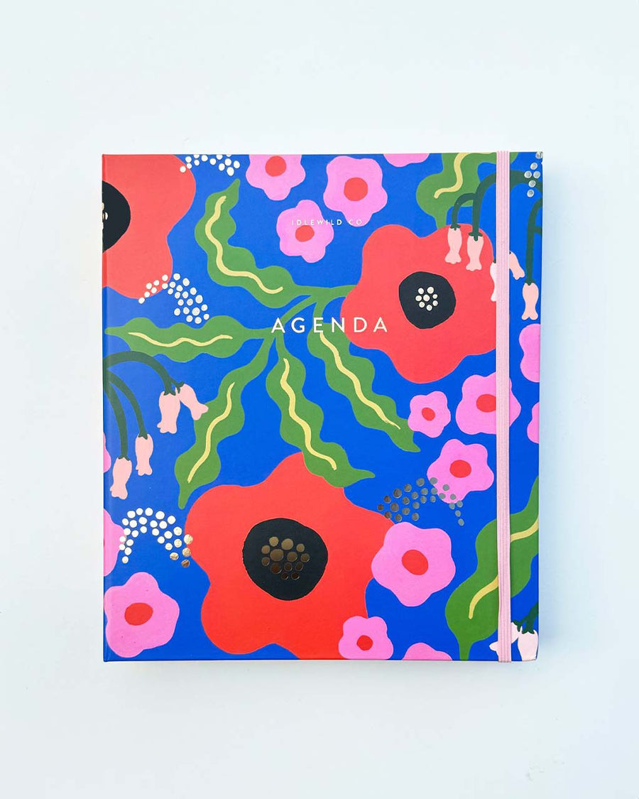 non-dated planner with blue ground and abstract 'wavy' daisy design