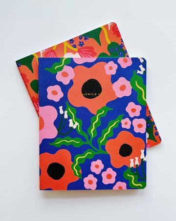 set of two notebooks: blue wavy daisy and orange abstract floral