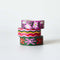 set of three abstract floral washi tape rolls: pink and white floral, colorful wavy squiggles, and pink and red abstract floral