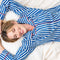 model wearing blue and white vertical stripe pj set