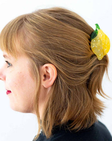 model wearing lemon shaped hair claw