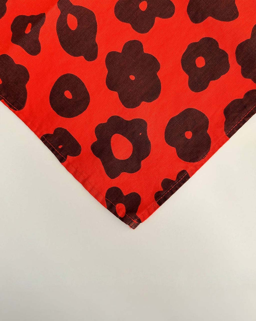 red napkin with with black abstract flower pattern