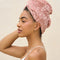 side view of model wearing Terracotta Plush Microfiber Hair Towel