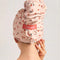 back view of light pink large absorbent XL hair towel with all over cherry print