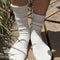 model wearing white textured fluffy socks