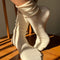 model wearing cream breezy sneaker socks