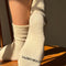 bottoms of model wearing cream breezy sneaker socks