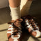 model wearing cream breezy sneaker socks