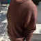 model wearing dark brown mohair crew neck sweater