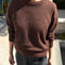 model wearing dark brown mohair crew neck sweater